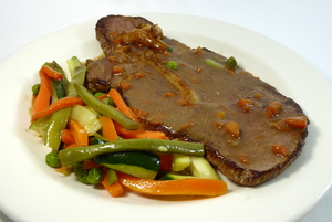  Veal steak served with mixed vegetables
