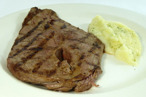 Grilled veal steak with mashed potatoes