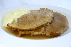 Roasted ham with mustard gravy and mashed potatoes