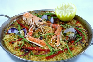 Paella with langoustines, clams, rabbit and squid