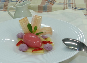 Rhubarb garnished with strawberry-rhubarb ice cream, glazed rhubarb and caramel