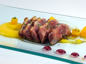 Roasted duck breast with blueberry sauce and peach purée