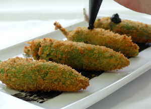 Stuffed peppers with squid in its own ink