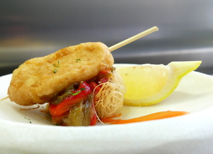 Battered  hake with piperrada (roasted green peppers, fried red peppers, onion, garlic and tomato)
