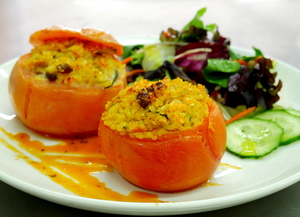 Bulgur, sultanas, red pesto stuffed tomatoes with salad