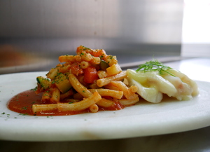 Homemade macaroni with cod and vegetables