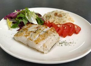 Griddled hake with tomato and garlic salad and noodles