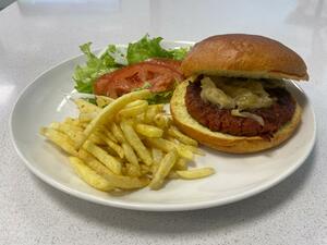 Vegetable burger with salad and fries 