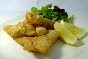 Battered cod with lettuce, tomato and onion salad