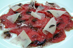 Veal tenderloin carpaccio with quince jelly, cheese flakes and vinaigrette