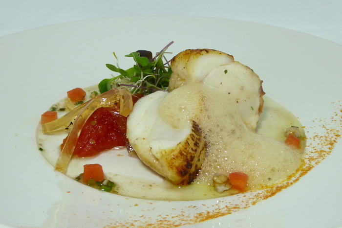 Roasted monkfish with tomato marmalade and fresh germinated salad