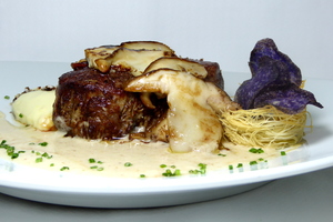 Grilled veal tenderloin with mushroom sauce