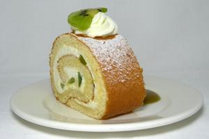 Kiwi and whipped cream sponge cake roll