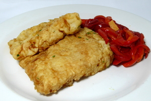 Battered hake with red peppers stew