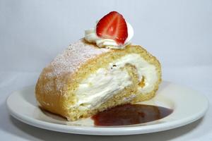 Strawberry and whipped cream sponge cake roll