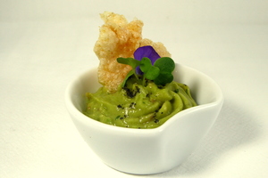 Guacamole, rice cake and black olive crumbs