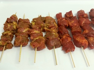 Curried pork brochettes