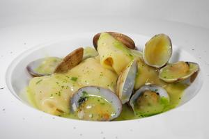 Monkfish ravioli in clam sauce