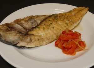 Grilled gilt–head bream with red pepper and onion stew 