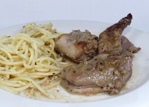 Rabbit seasoned with mustard stew and garnished with spaghetti