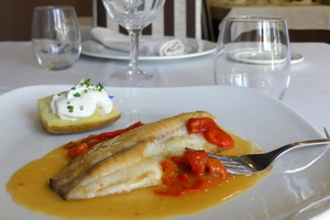 Tilapia with green pepper sauce and baked potatoes