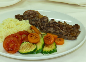 Grilled veal loin with couscous and grilled vegetables