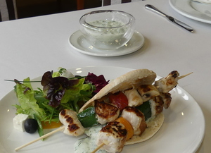 Souvlaki with tzatziki, pita bread and salad 