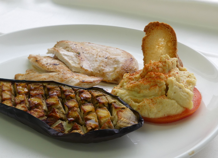 Chicken breast fillets with roasted aubergine and hummus