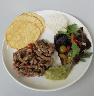 Roasted pork "mexican tacos" with vegetables, guacamole and rice